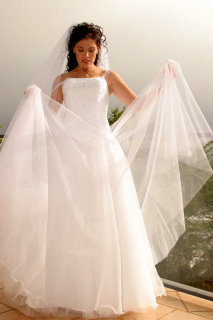 tulle wedding dress woman holding parts of it
